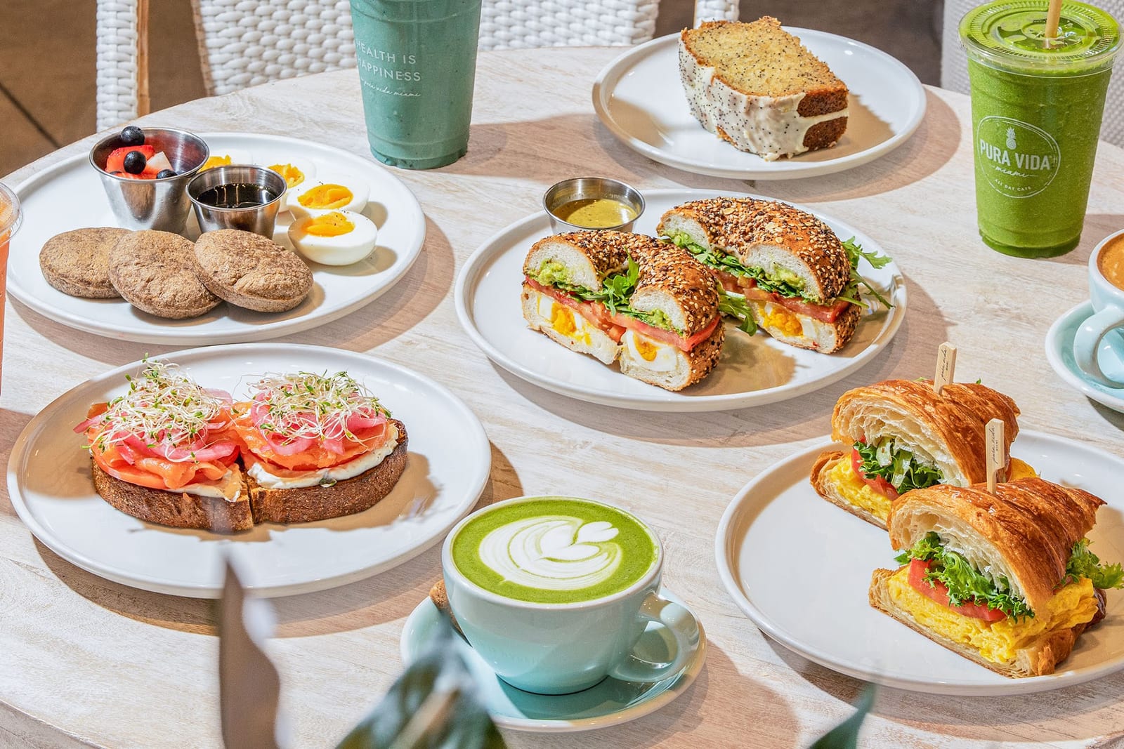 A breakfast spread of toasts, bagels and matcha at Pura Vida in Coral Gables