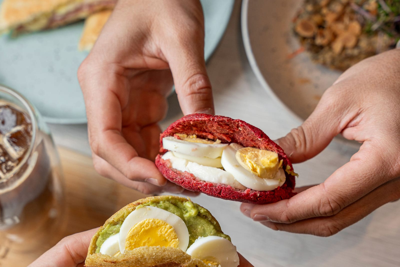 Beet arepa and avocado toast with egg at GROU Coffee + Cowork in Coral Gables
