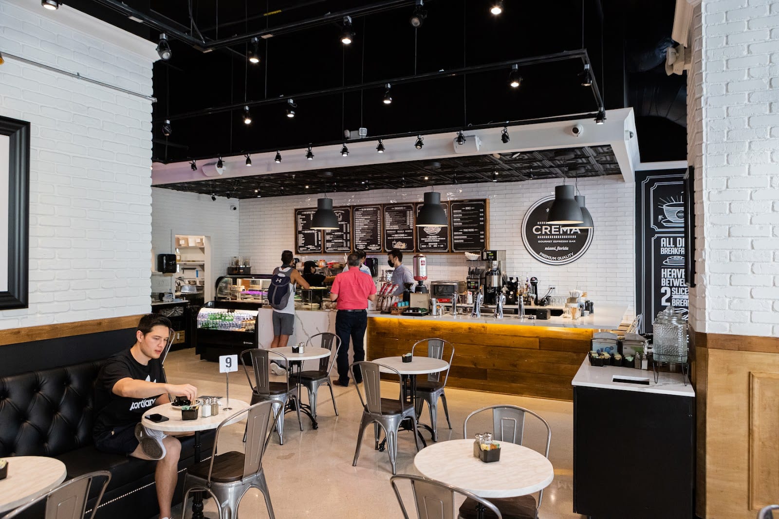 The counter and seating room at Crema Gourmet Espresso Bar on Brickell Avenue in Miami