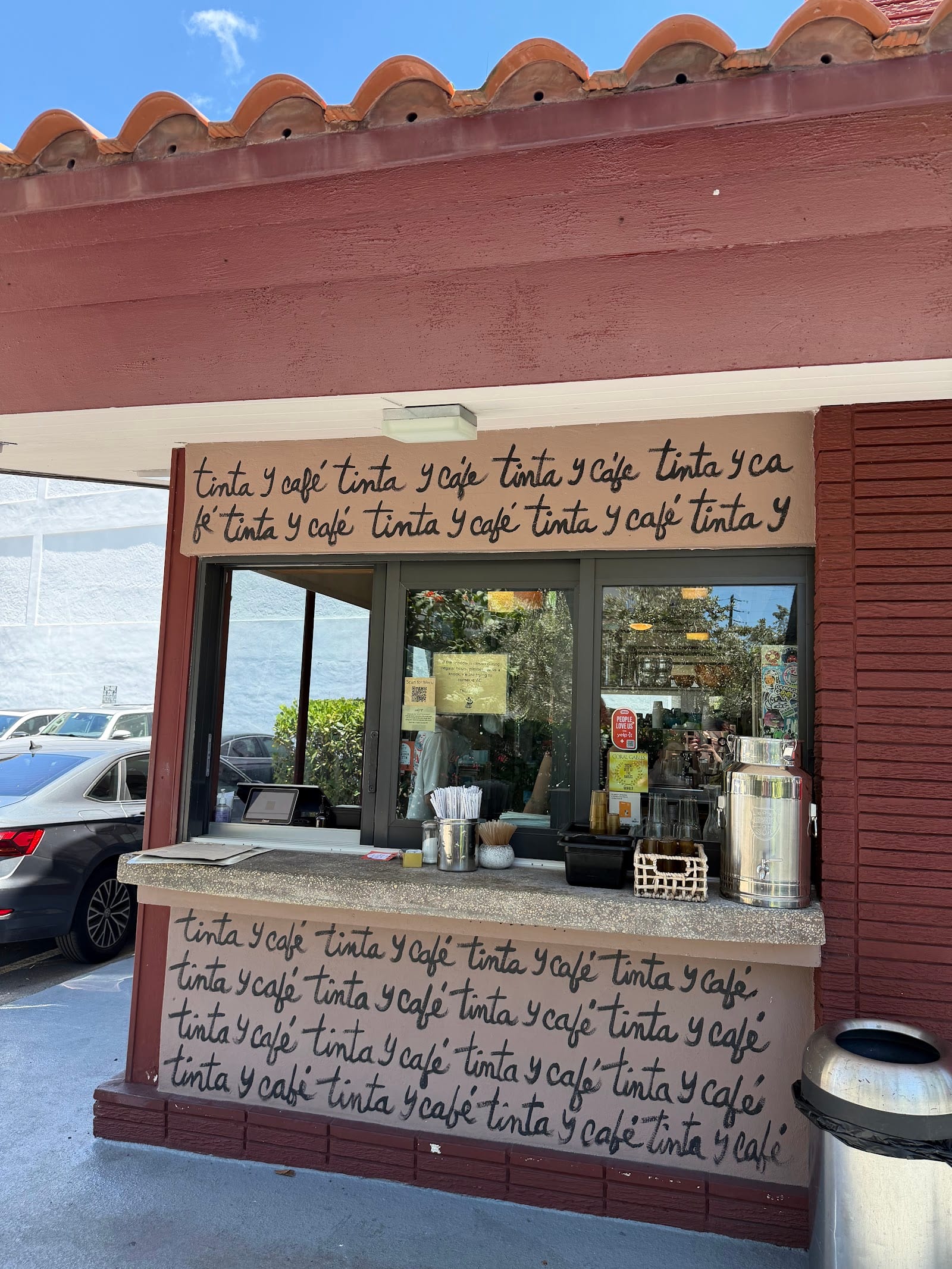 Tinta y Cafe, Cuban cafe with bookshelves along the glass facade on Ponce de Leon Boulevard
