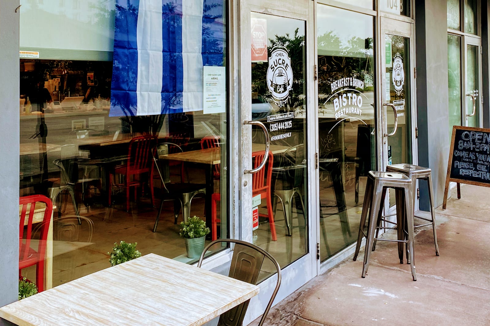 Sidewalk tables outside Chef Sucre Cafe on Biltmore Way in Coral Gables